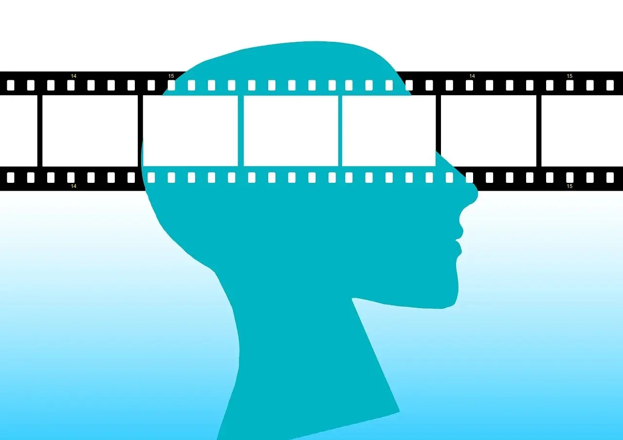 A human head with a film strip, symbolizing how we use the movies in your head, frame by frame, in counseling to gain new perspectives on old problems.